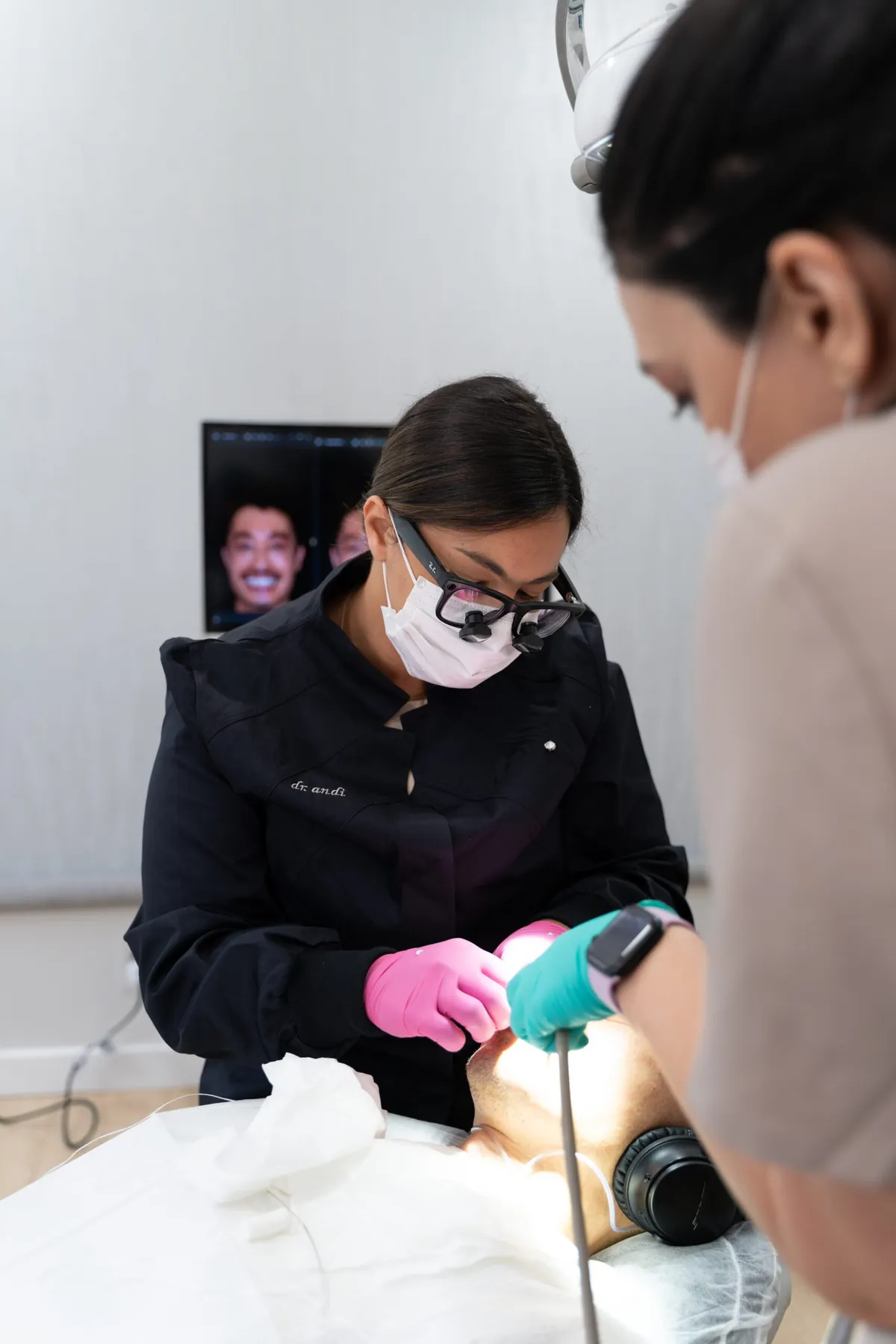 Dr. Andi-Jean Miro in loupes during a cosmetic dentistry appointment