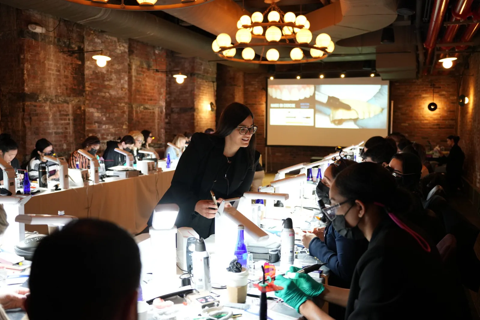 Dr. Andi-Jean Miro teaching a hands-on Stribe course to a room of dentists