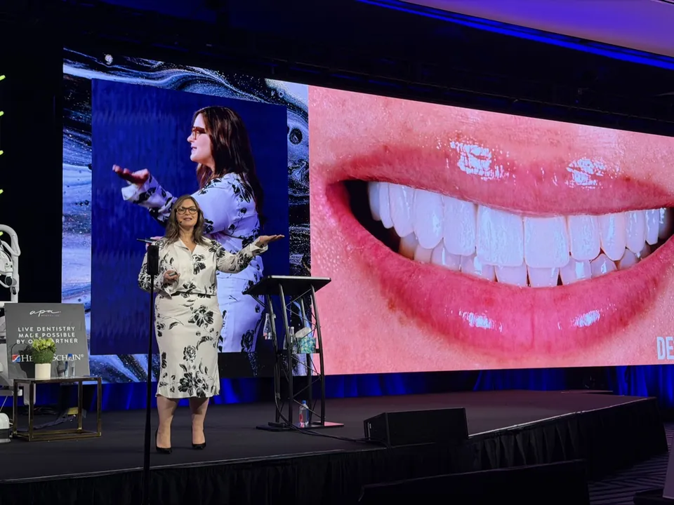 Dr. Andi-Jean Miro presenting a porcelain veneer smile transformation on stage — how long do veneers last